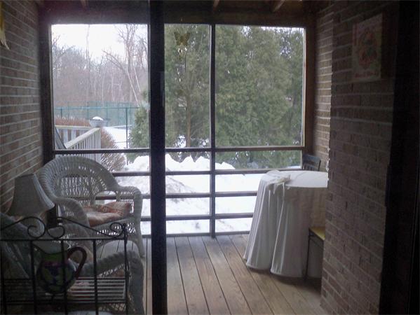27 Cobblestone Lane, Unit 27 Worcester, MA 01606 - Photo 21 of 24 a room with wooden floor and a glass door