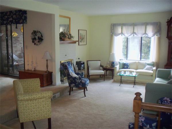 27 Cobblestone Lane, Unit 27 Worcester, MA 01606 - Photo 3 of 24 a living room with furniture and a large window