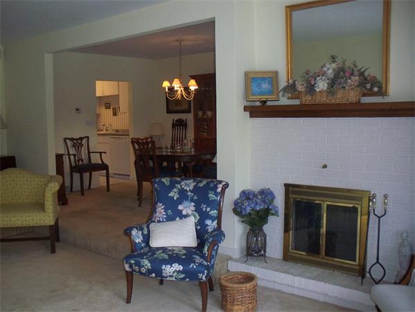 27 Cobblestone Lane, Unit 27 Worcester, MA 01606 - Photo 5 of 24 a living room with furniture and a fireplace