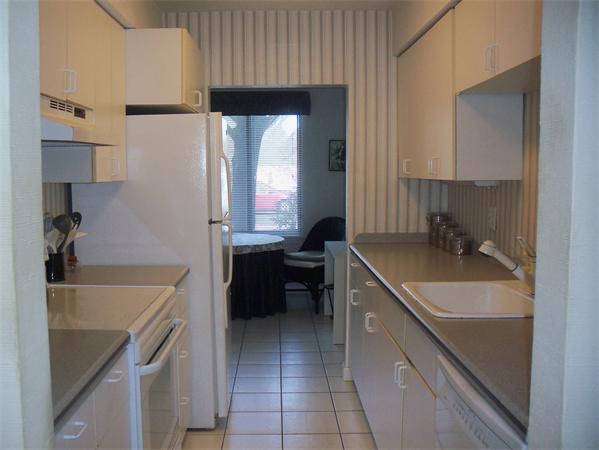 27 Cobblestone Lane, Unit 27 Worcester, MA 01606 - Photo 8 of 24 a kitchen with a sink a stove and cabinets