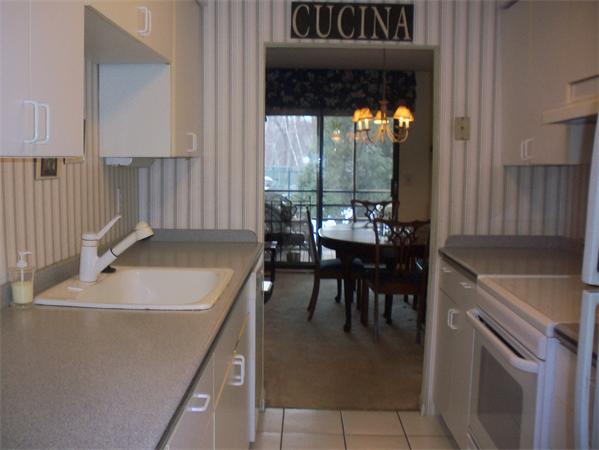 27 Cobblestone Lane, Unit 27 Worcester, MA 01606 - Photo 9 of 24 a kitchen with a sink and a stove top oven