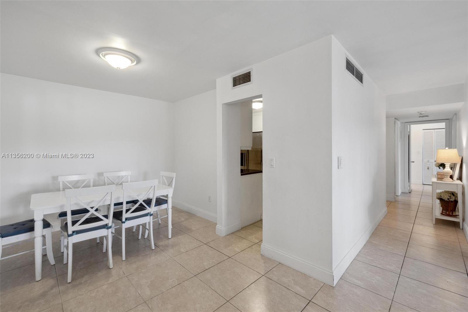 550 Ocean Drive, Unit 5C Key Biscayne, FL 33149 - Photo 13 of 21 a view of a dining room with furniture