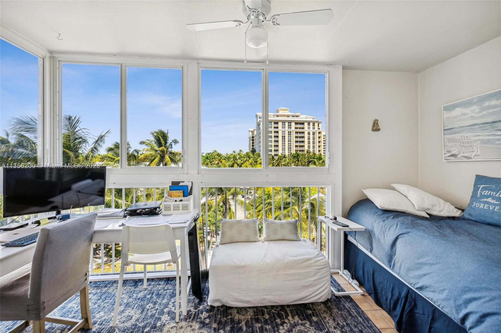 550 Ocean Drive, Unit 5C Key Biscayne, FL 33149 - Photo 10 of 21 a living room with furniture and a flat screen tv