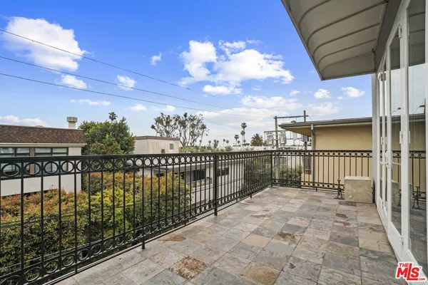a view of balcony with a potted plant