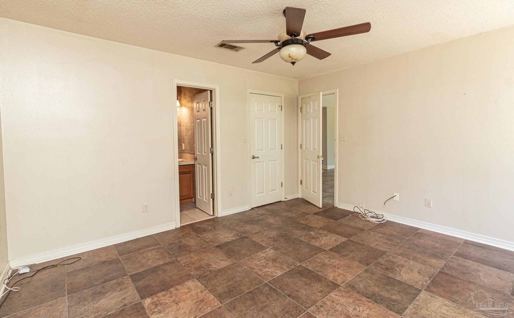 2394 Cove Road Navarre, FL 32566 - Photo 12 of 24 Master Bedroom with Walk In Closet