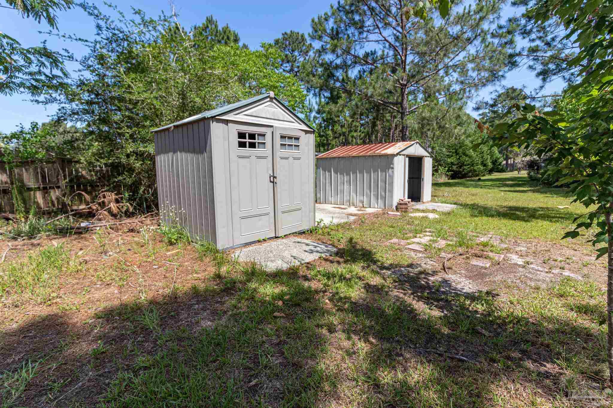 2394 Cove Road Navarre, FL 32566 - Photo 21 of 24 2 Storage Sheds on Concrete Slab
