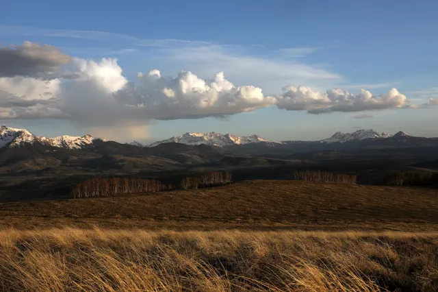 a view of lake with sunset