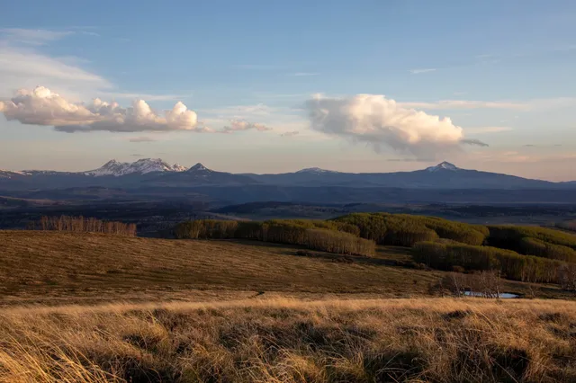 a view of an ocean and mountain