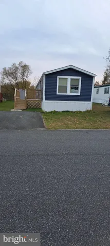 a swimming pool with outdoor seating and yard