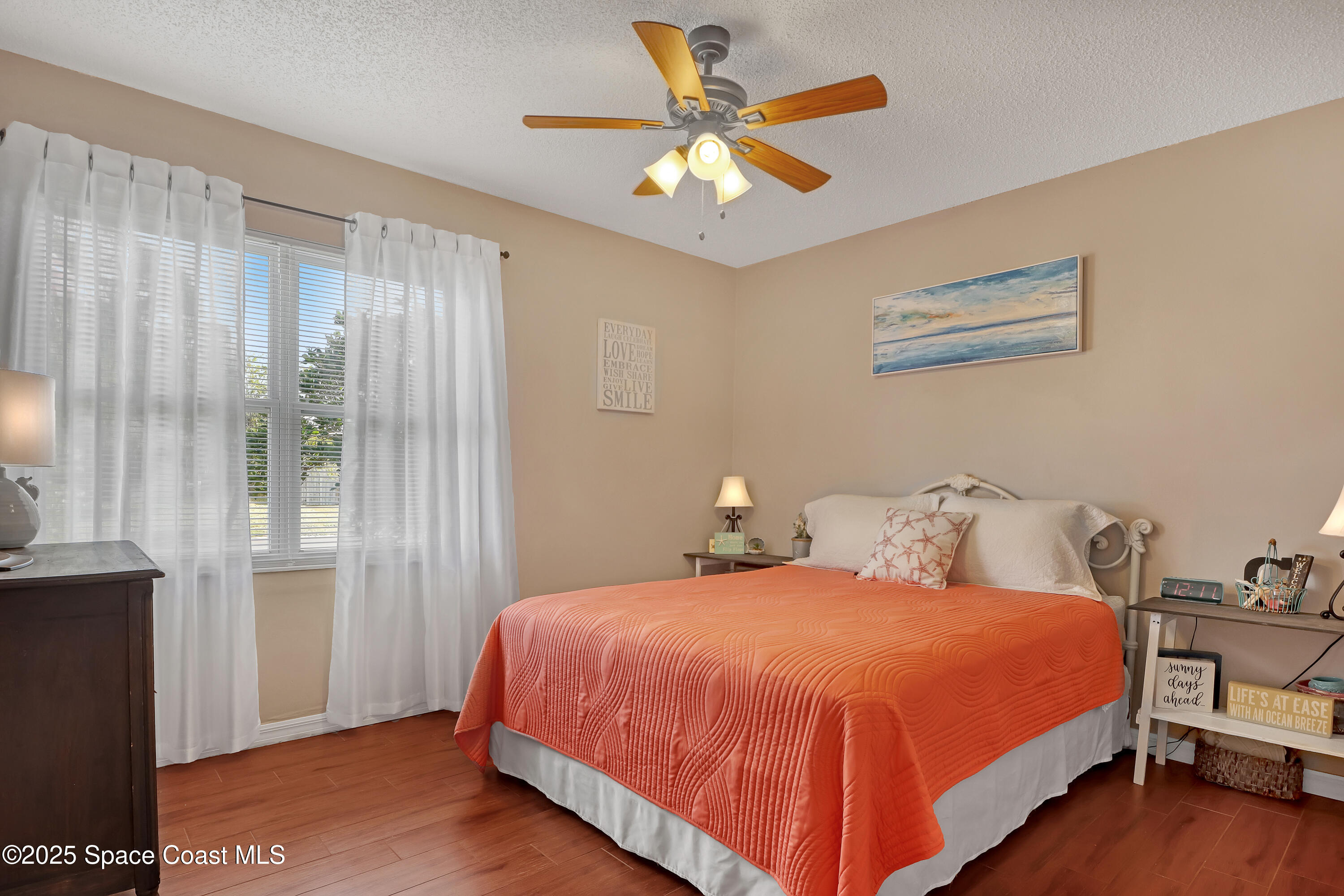 1513 Creel Road Northeast Palm Bay, FL 32905 - Photo 16 of 31 a bedroom with a bed and a window
