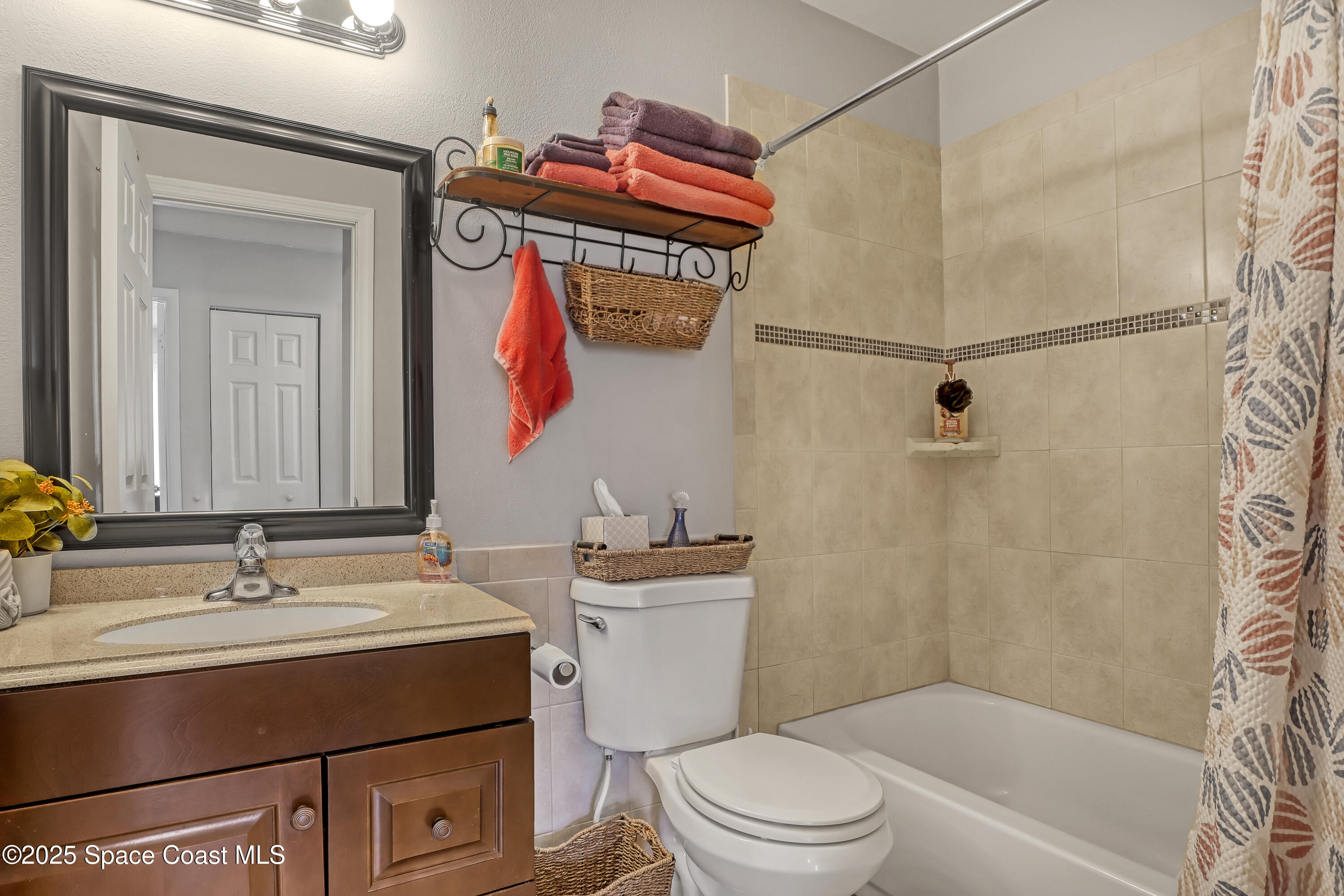 1513 Creel Road Northeast Palm Bay, FL 32905 - Photo 19 of 31 a bathroom with a sink toilet vanity and shower