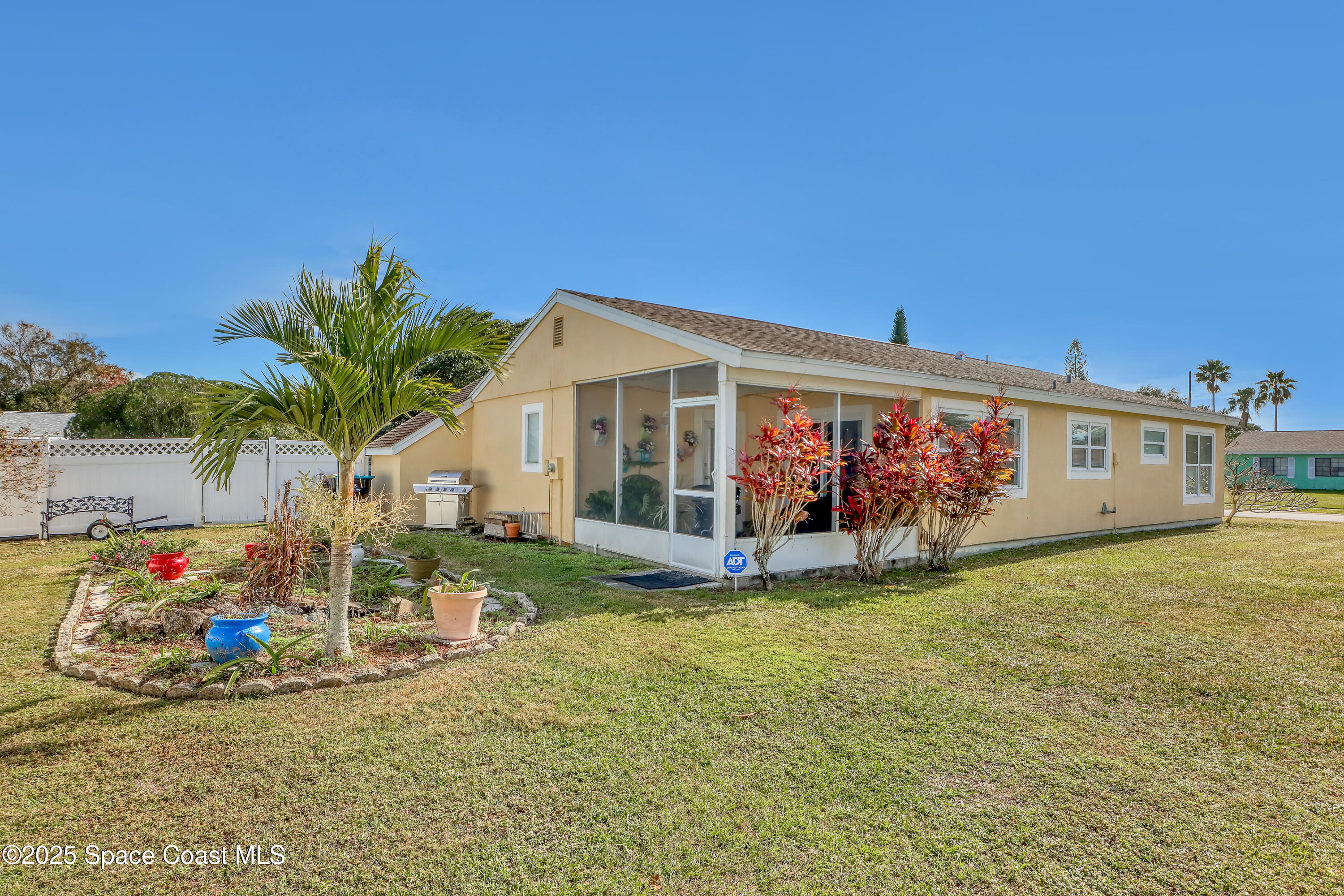 1513 Creel Road Northeast Palm Bay, FL 32905 - Photo 22 of 31 a view of a house with garden