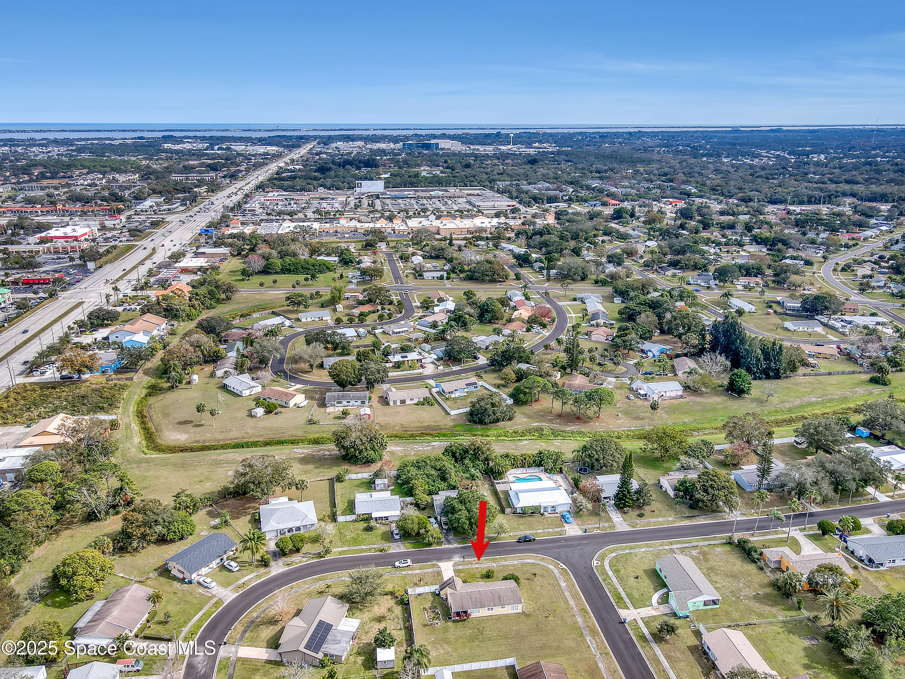1513 Creel Road Northeast Palm Bay, FL 32905 - Photo 27 of 31 an aerial view of residential houses with outdoor space