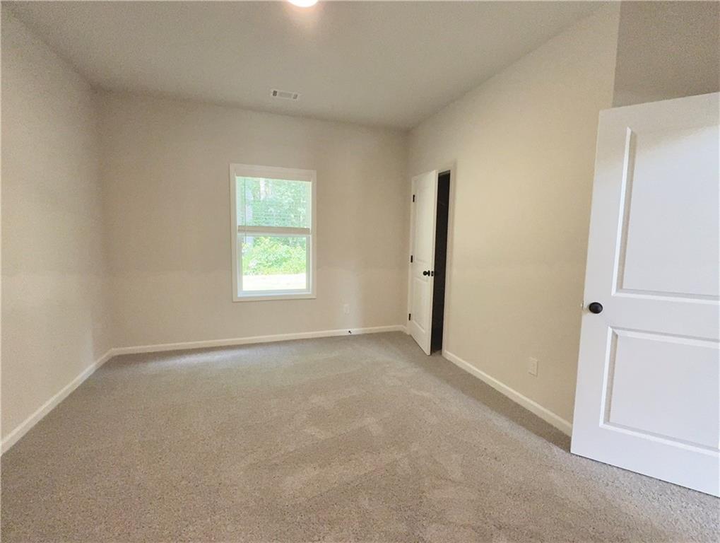 2225 Sun Valley Buford, GA 30519 - Photo 11 of 23 an empty room with windows and closet
