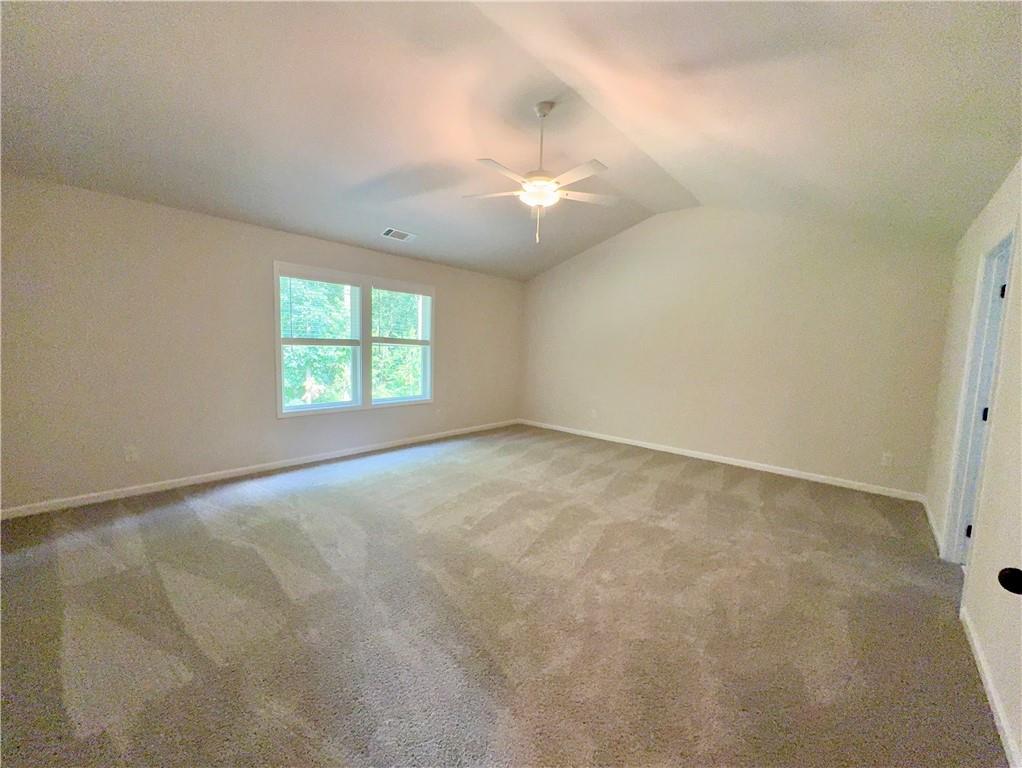 2225 Sun Valley Buford, GA 30519 - Photo 14 of 23 an empty room with windows and fan