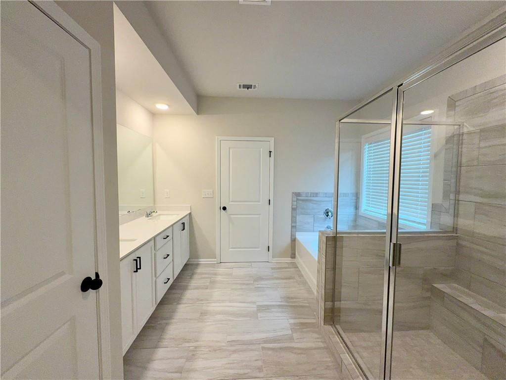 2225 Sun Valley Buford, GA 30519 - Photo 17 of 23 a bathroom with granite countertop shower