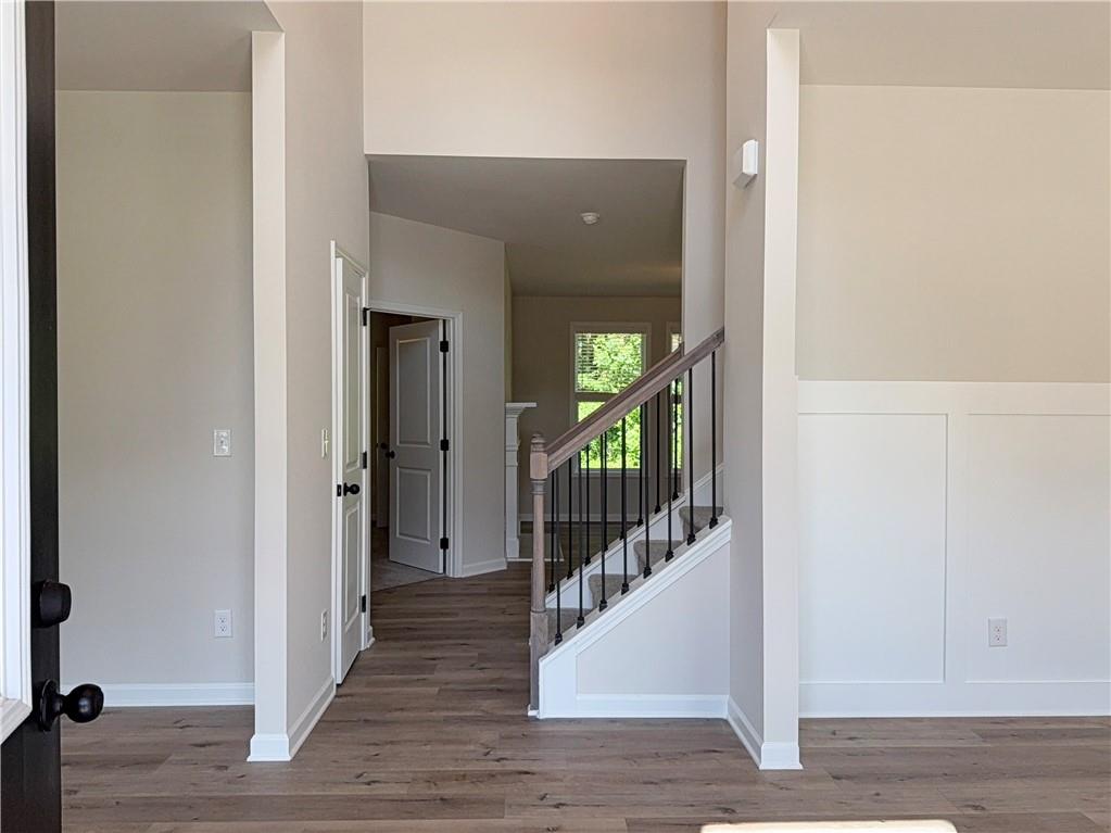 2225 Sun Valley Buford, GA 30519 - Photo 4 of 23 a view of a hallway with wooden floor and stairs