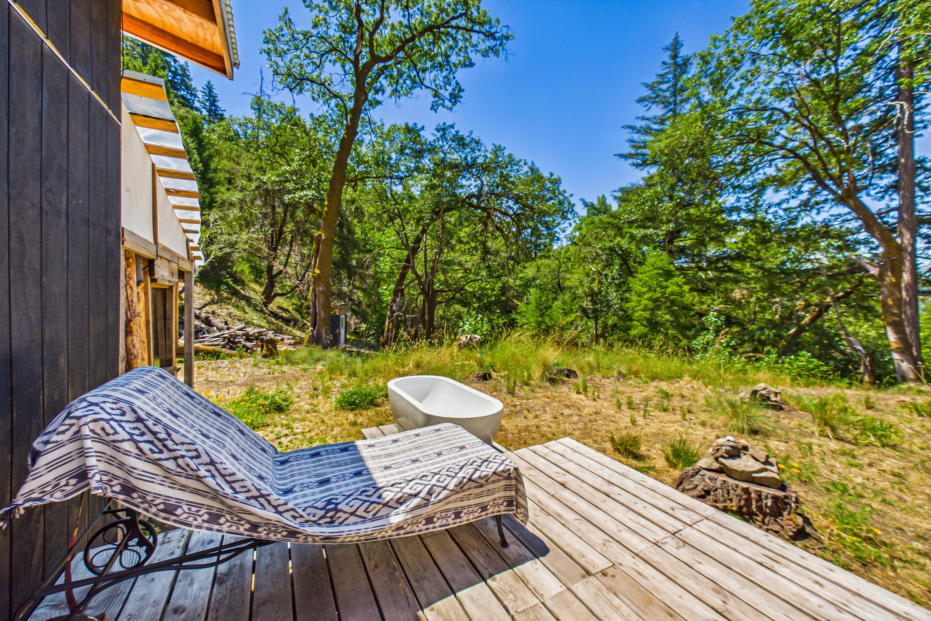 60890 Bell Springs Road Laytonville, CA 95454 - Photo 17 of 77 a view of a balcony with two chairs and a potted plant