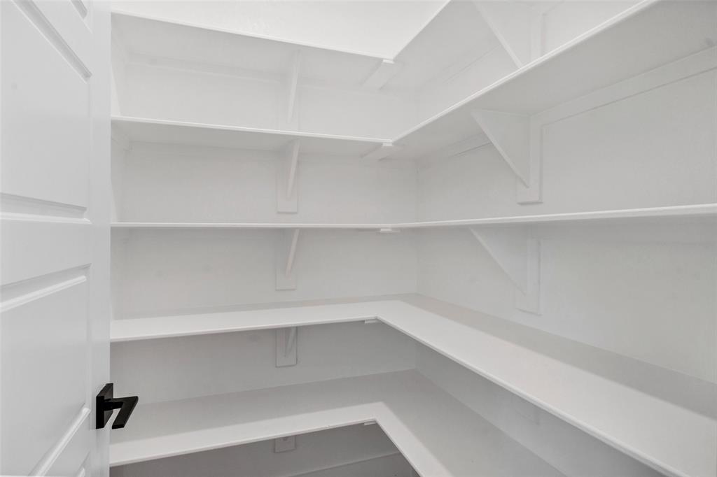 3306 Promenade Court Granbury, TX 76049 - Photo 18 of 40 a view of an empty walk in closet