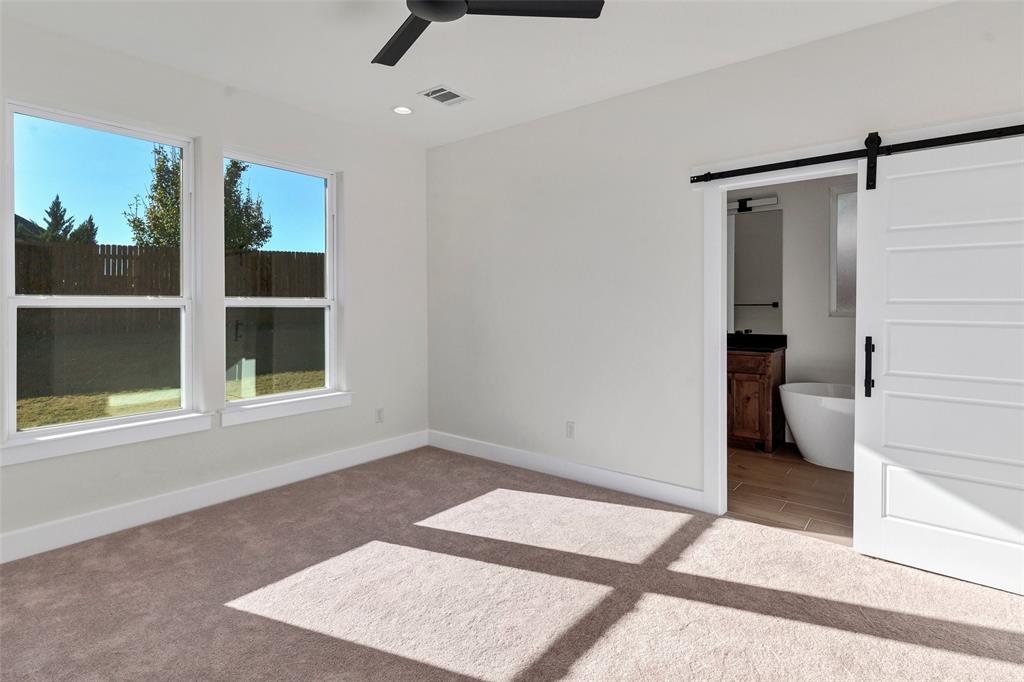 3306 Promenade Court Granbury, TX 76049 - Photo 22 of 40 a view of an empty room with closet and a window