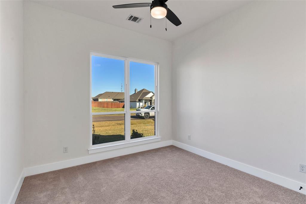 3306 Promenade Court Granbury, TX 76049 - Photo 27 of 40 an empty room with windows