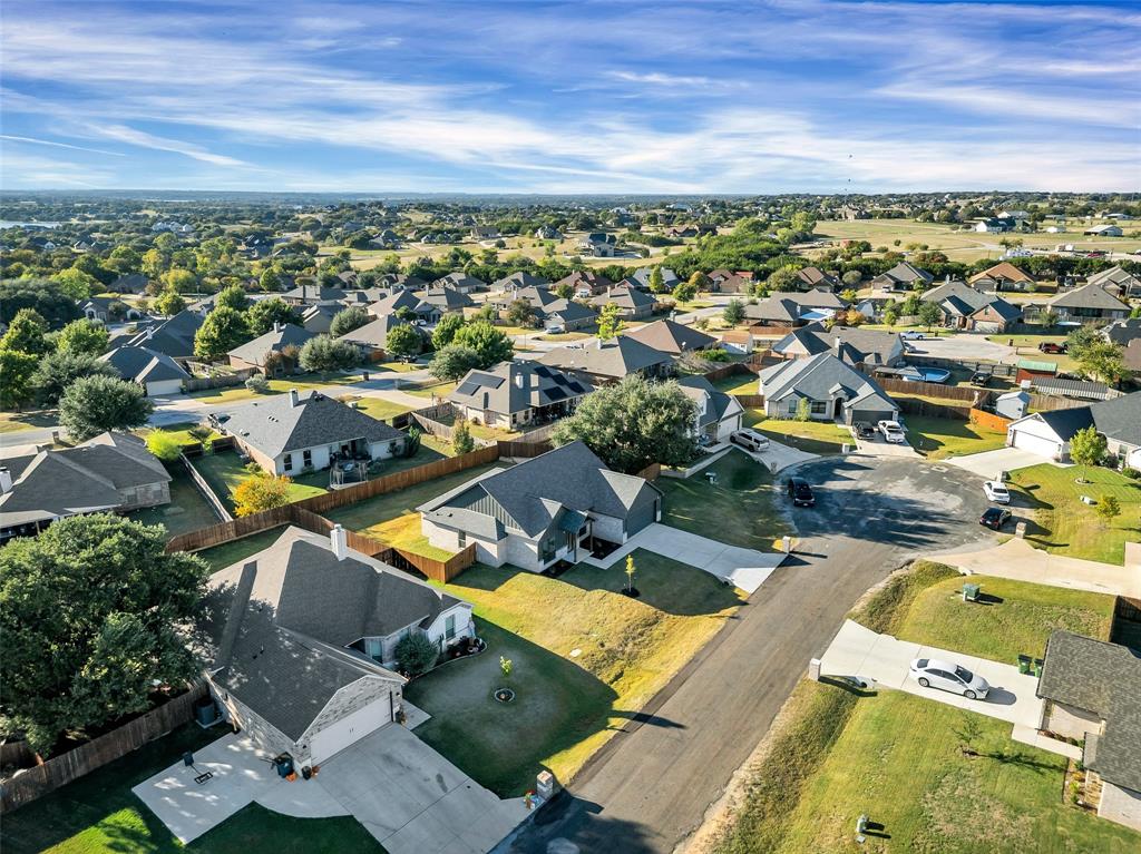 3306 Promenade Court Granbury, TX 76049 - Photo 39 of 40 an aerial view of residential houses with outdoor space