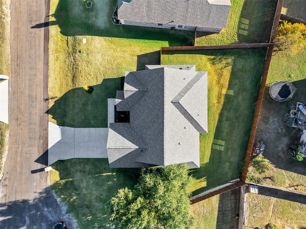 3306 Promenade Court Granbury, TX 76049 - Photo 40 of 40 an aerial view of a house with a yard basket ball court and outdoor seating