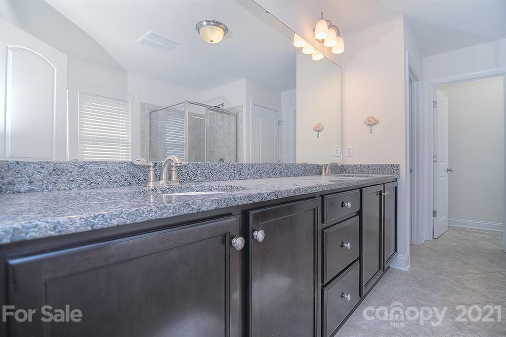 2001 Fallondale Road Waxhaw, NC 28173 - Photo 13 of 36 a bathroom with a granite countertop double vanity sink and a mirror
