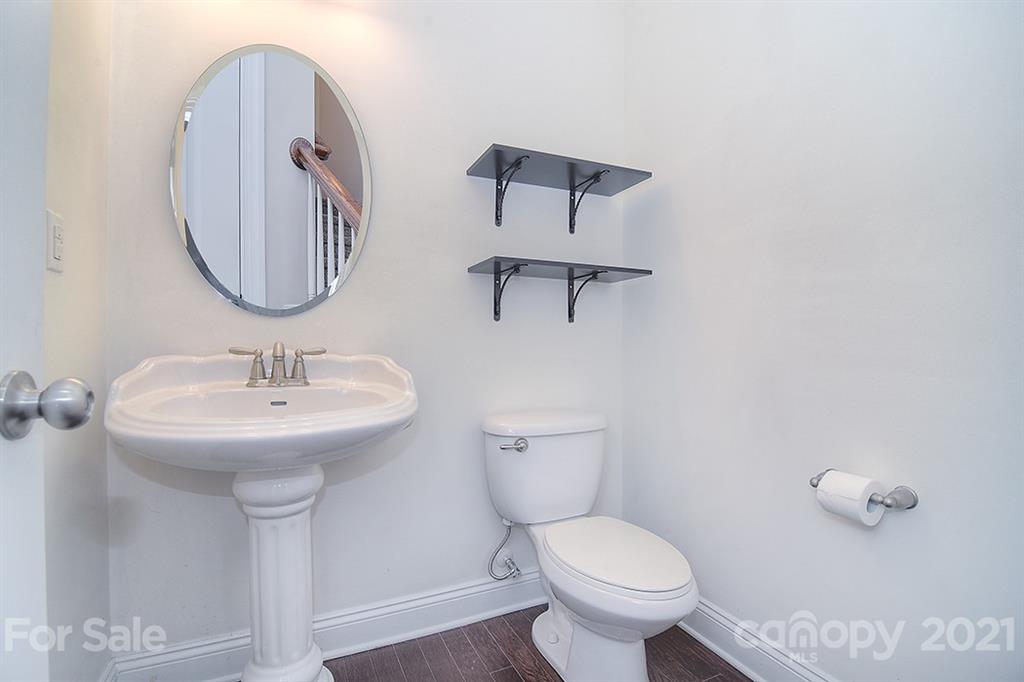 2001 Fallondale Road Waxhaw, NC 28173 - Photo 21 of 36 a bathroom with a toilet a sink and mirror