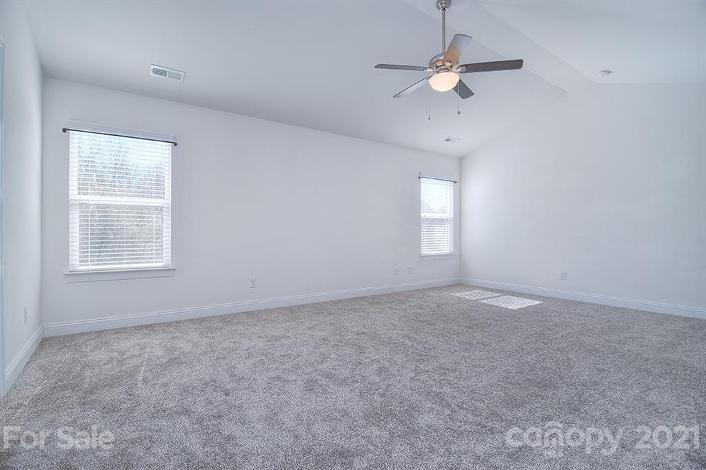 2001 Fallondale Road Waxhaw, NC 28173 - Photo 24 of 36 an empty room with a window and a ceiling fan