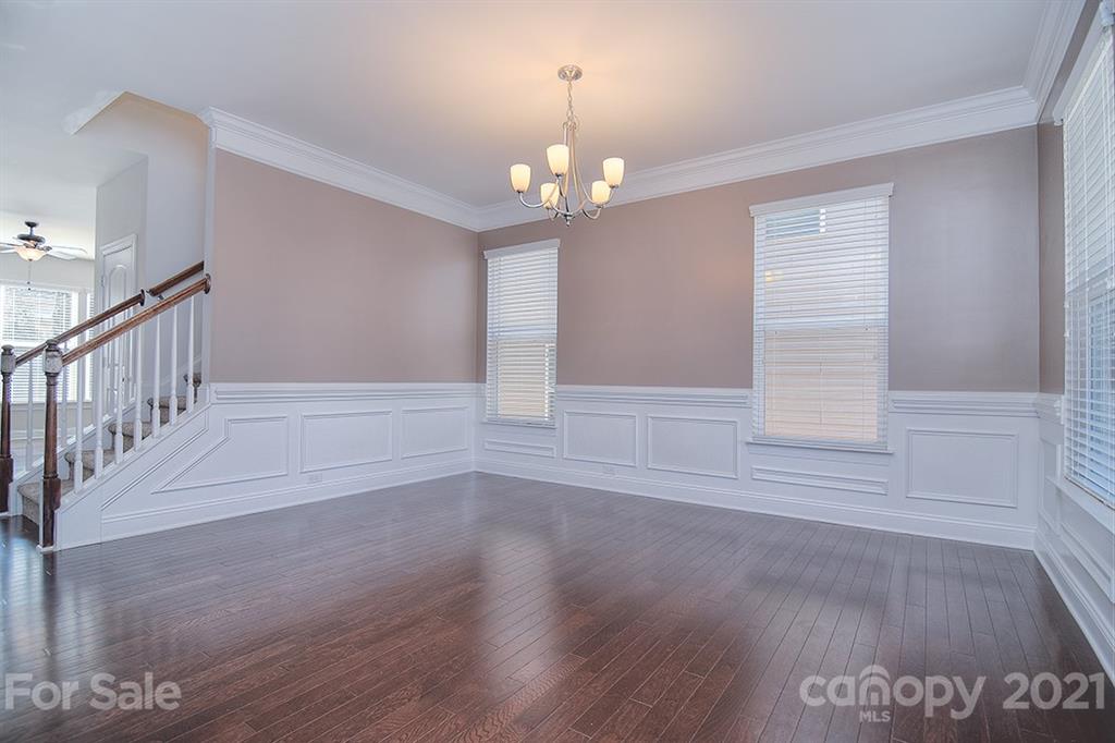 2001 Fallondale Road Waxhaw, NC 28173 - Photo 28 of 36 a view of an empty room with wooden floor and a window