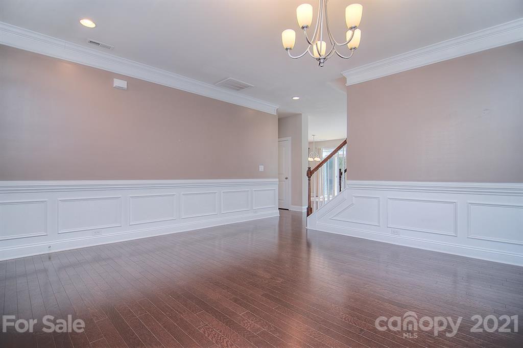 2001 Fallondale Road Waxhaw, NC 28173 - Photo 29 of 36 a view of an empty room with wooden floor and stairs