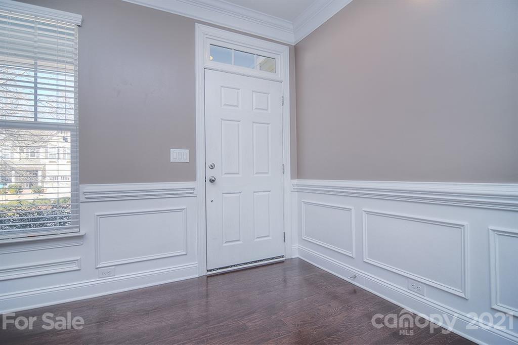 2001 Fallondale Road Waxhaw, NC 28173 - Photo 30 of 36 a view of an empty room with wooden floor and cabinet