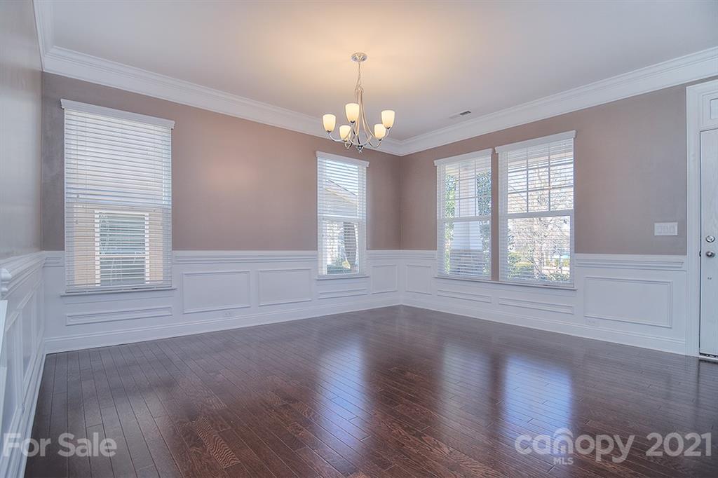 2001 Fallondale Road Waxhaw, NC 28173 - Photo 31 of 36 a view of an empty room with wooden floor and a window