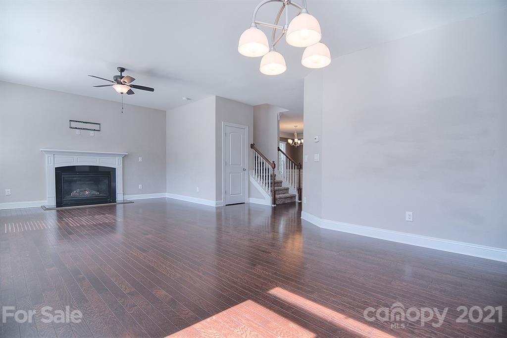 2001 Fallondale Road Waxhaw, NC 28173 - Photo 7 of 36 a view of a livingroom with a ceiling fan wooden floor and a ceiling fan