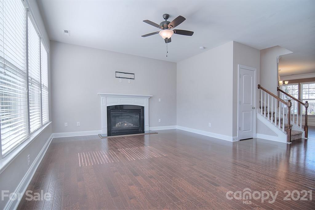 2001 Fallondale Road Waxhaw, NC 28173 - Photo 10 of 36 a view of an empty room with a window and wooden floor