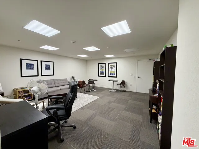 a view of a patio with swimming pool table and chairs