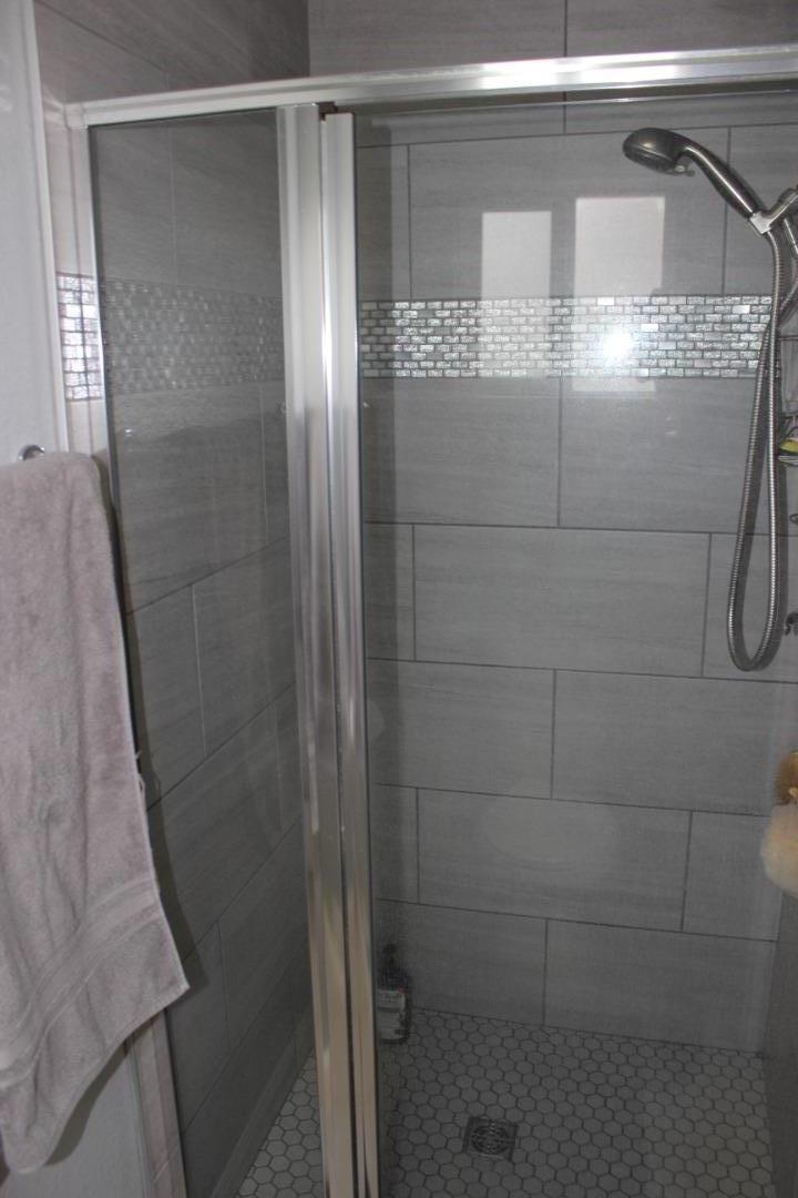4944 Canto Drive San Jose, CA 95124 - Photo 12 of 20 a bathroom with a glass shower door
