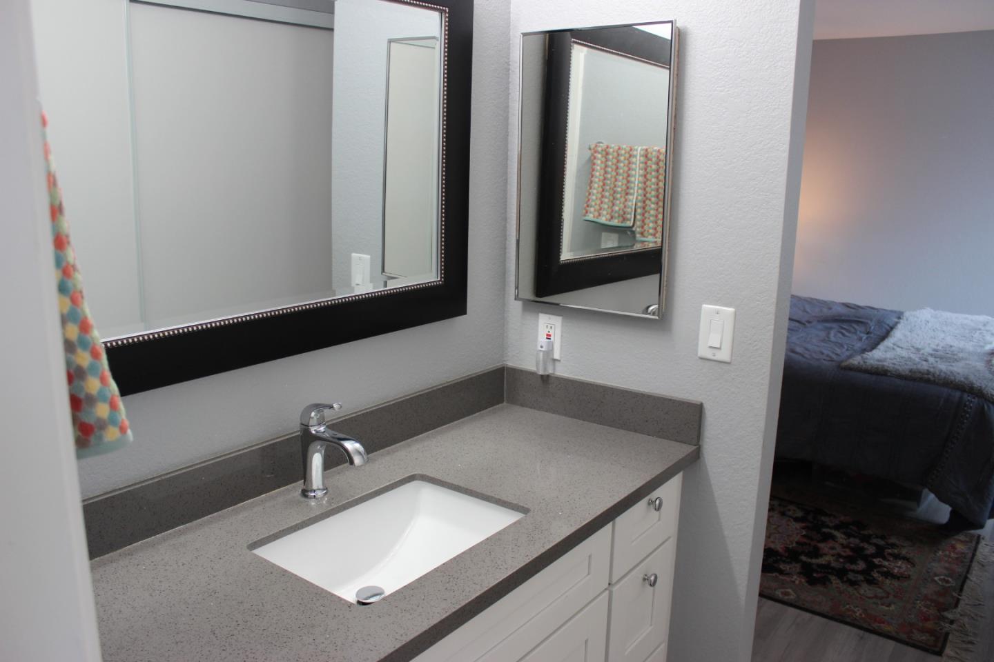4944 Canto Drive San Jose, CA 95124 - Photo 13 of 20 a bathroom with a sink and a mirror