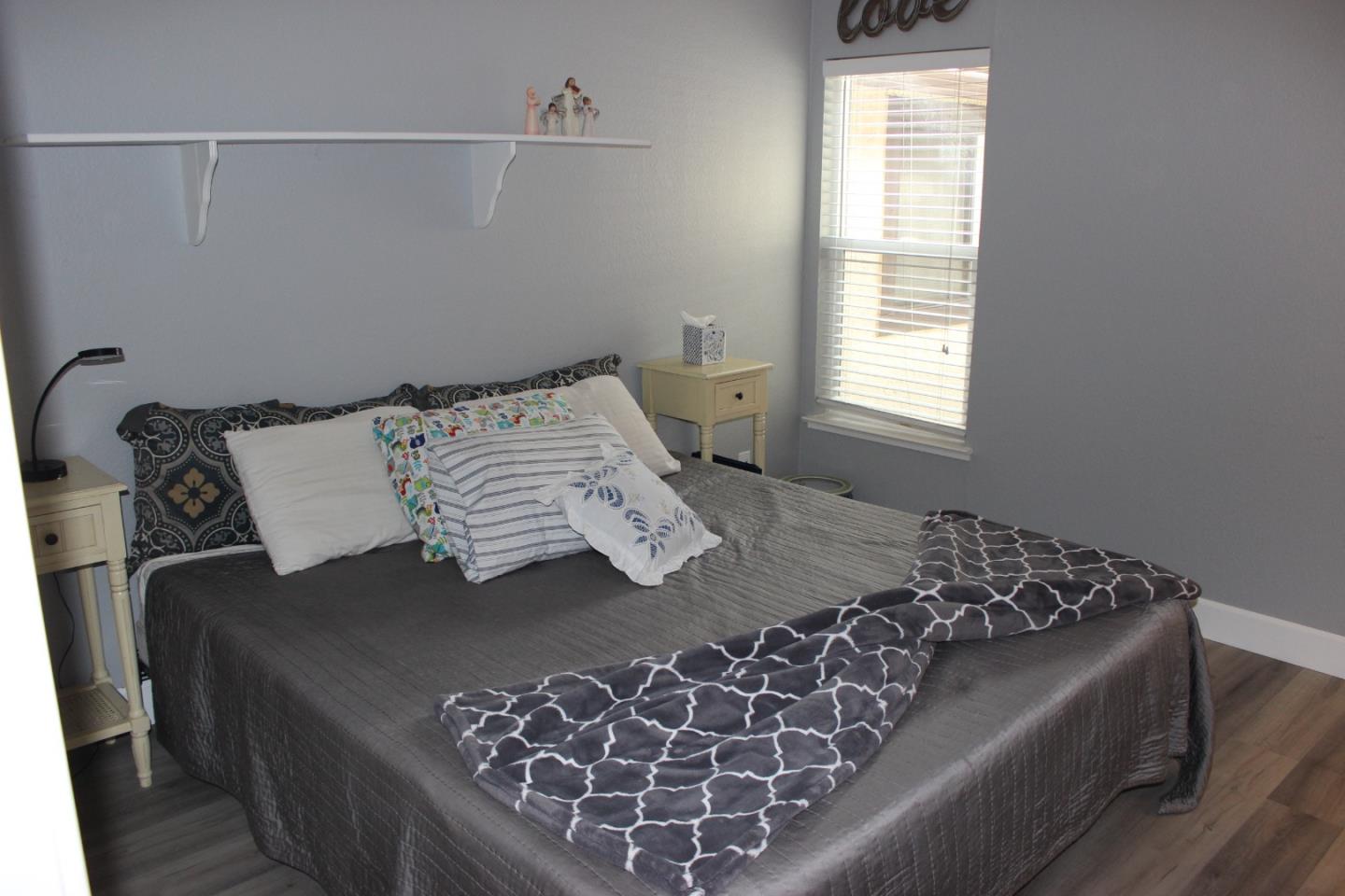 4944 Canto Drive San Jose, CA 95124 - Photo 14 of 20 a bed sitting in a bedroom next to a window