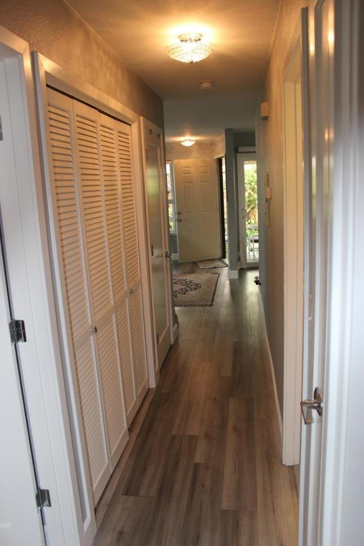 4944 Canto Drive San Jose, CA 95124 - Photo 15 of 20 a view of a hallway with wooden floor and staircase