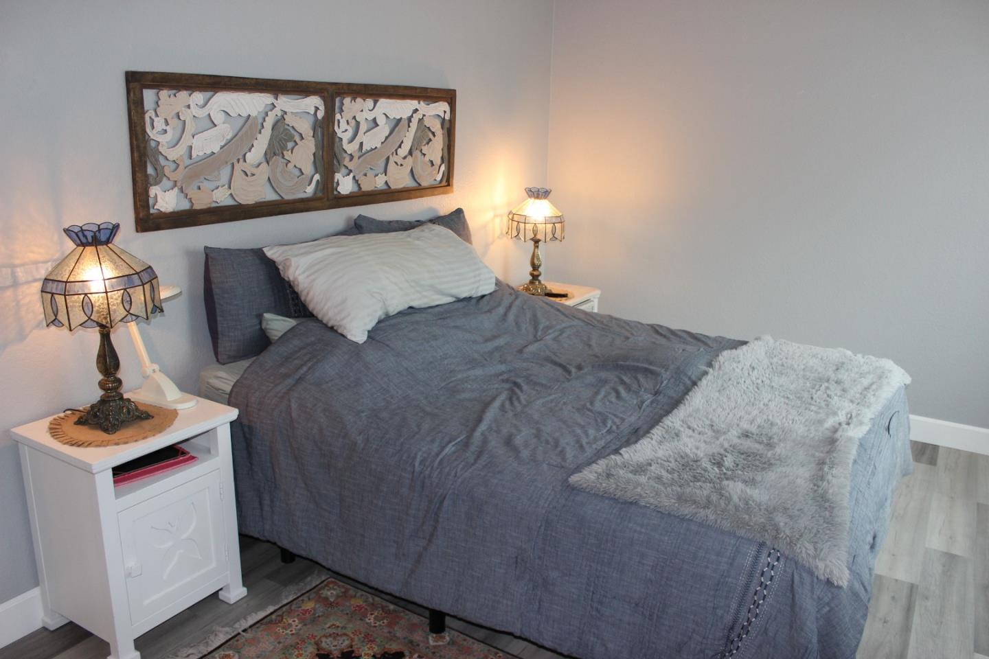 4944 Canto Drive San Jose, CA 95124 - Photo 10 of 20 a bedroom with a bed and a painting on the wall