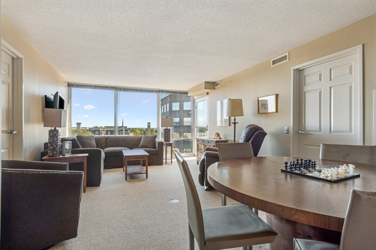 800 Elgin Road, Unit 909 Evanston, IL 60201 - Photo 5 of 15 a view of a dining room with furniture