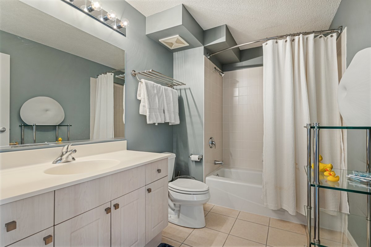 800 Elgin Road, Unit 909 Evanston, IL 60201 - Photo 10 of 15 a bathroom with a sink toilet and shower