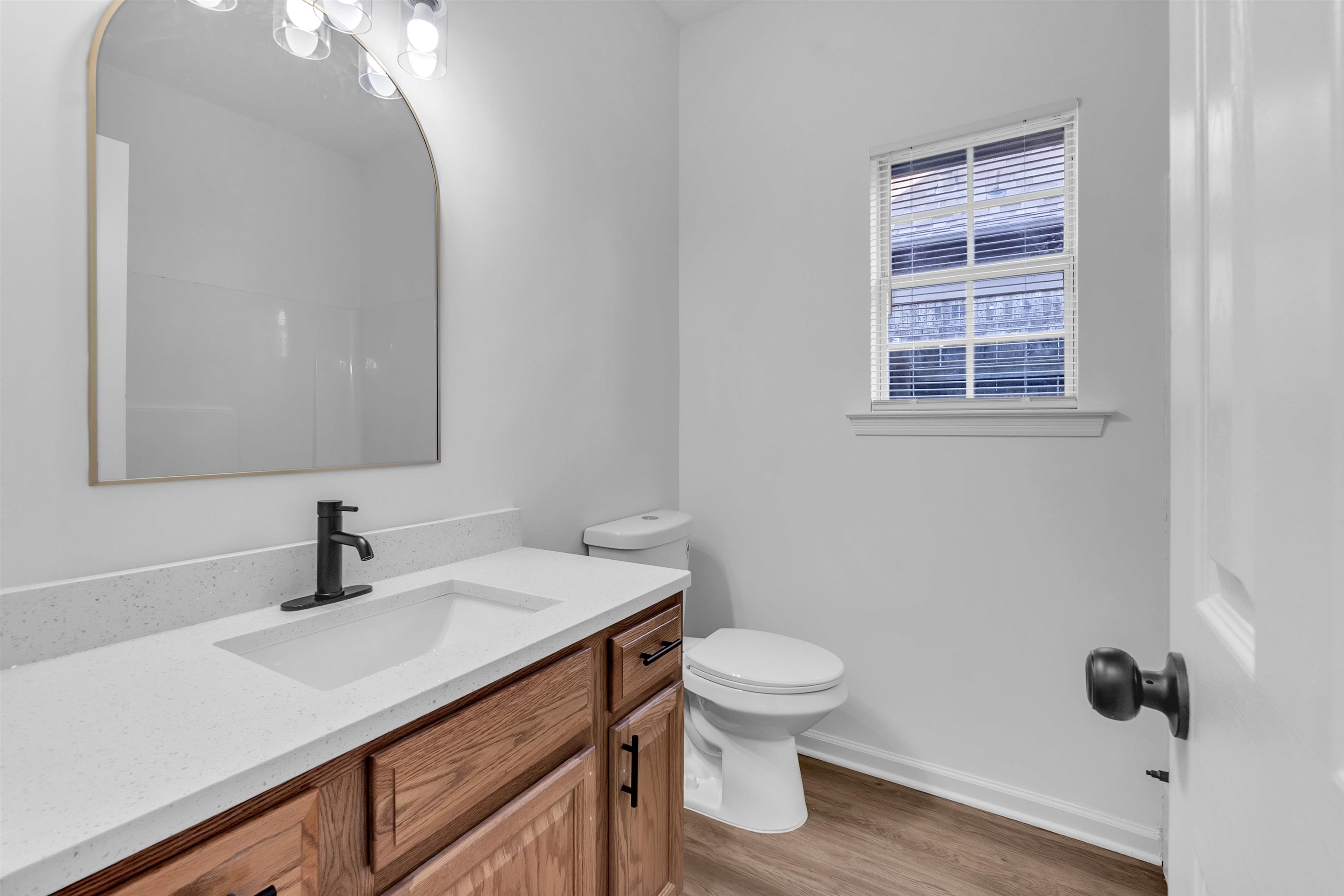 3904 August Moon Cove Memphis, TN 38135 - Photo 12 of 25 a bathroom with a sink a toilet a mirror and shower