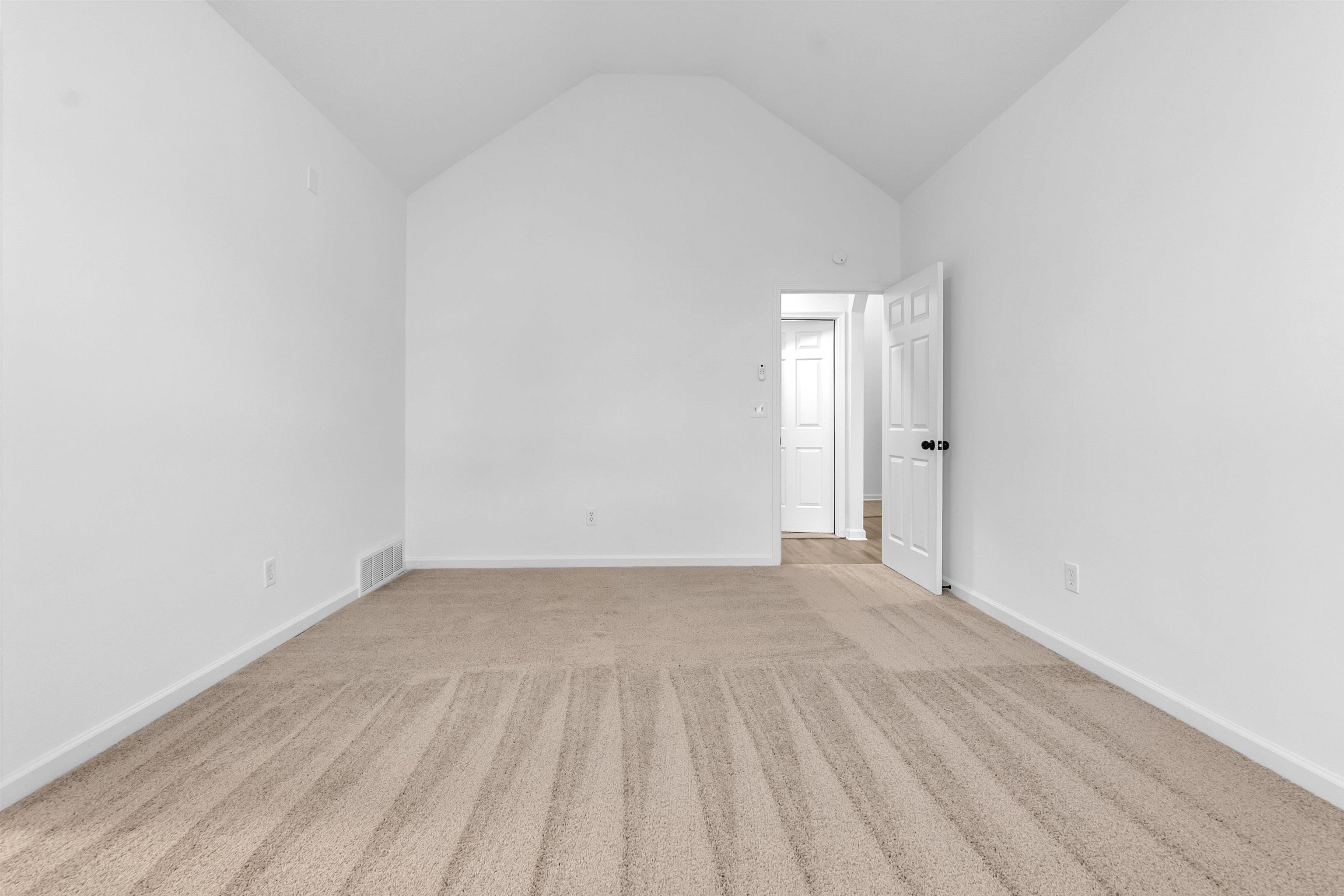 3904 August Moon Cove Memphis, TN 38135 - Photo 16 of 25 a view of an empty room and wooden floor