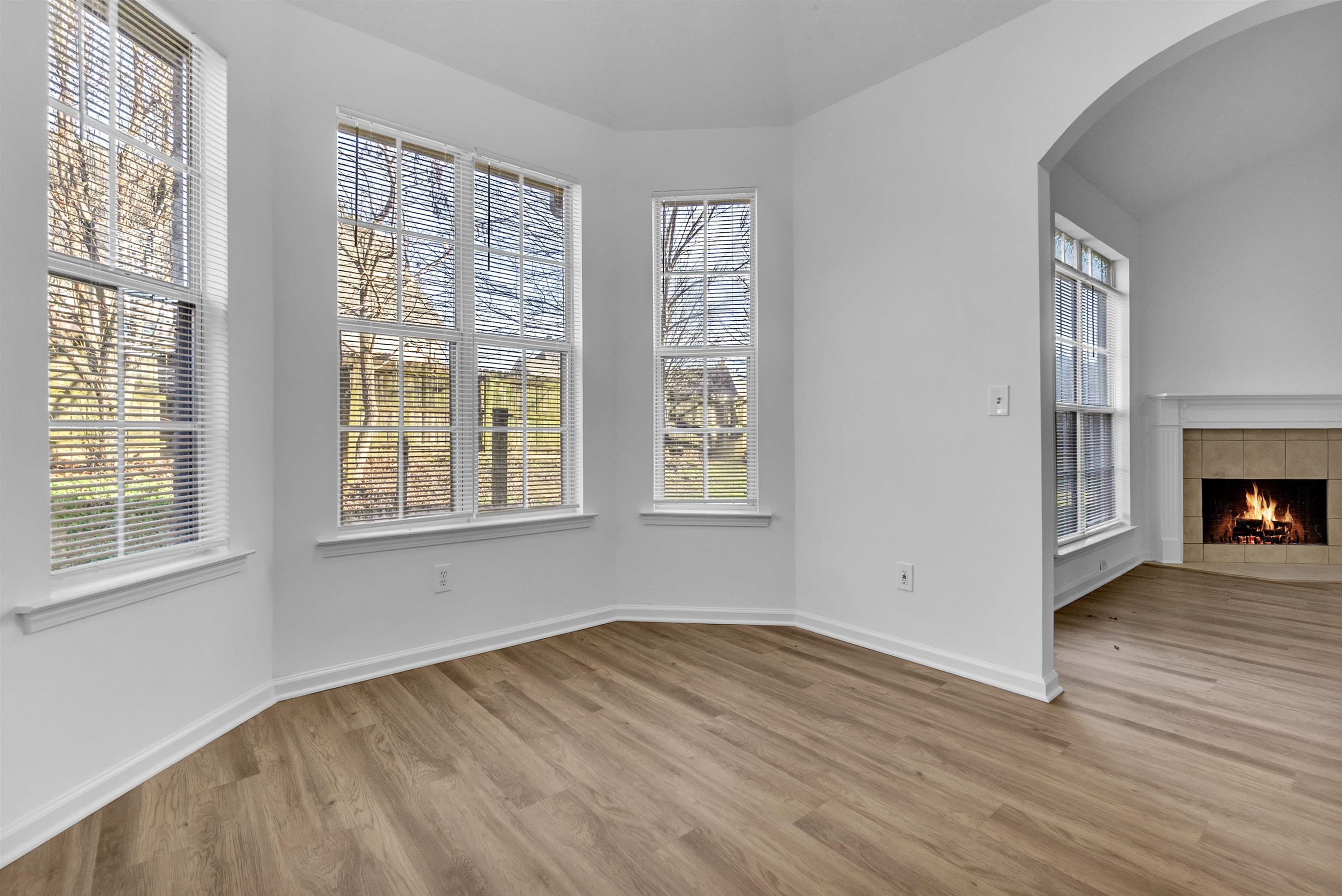 3904 August Moon Cove Memphis, TN 38135 - Photo 21 of 25 a view of empty room with wooden floor and fireplace