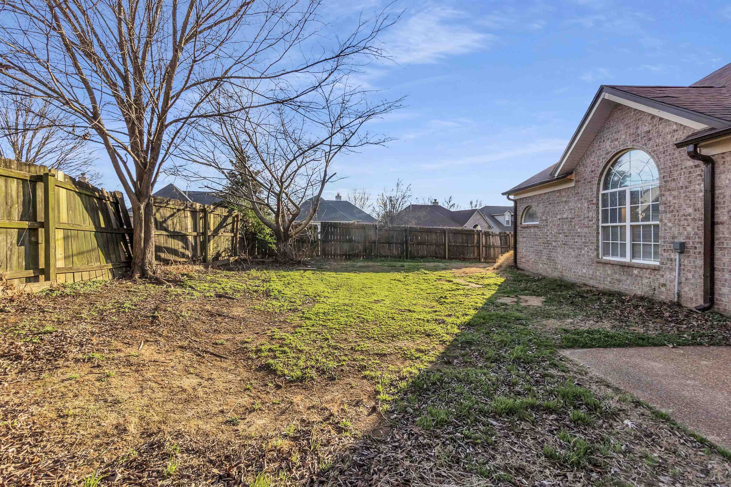 3904 August Moon Cove Memphis, TN 38135 - Photo 23 of 25 a front view of a house with a yard