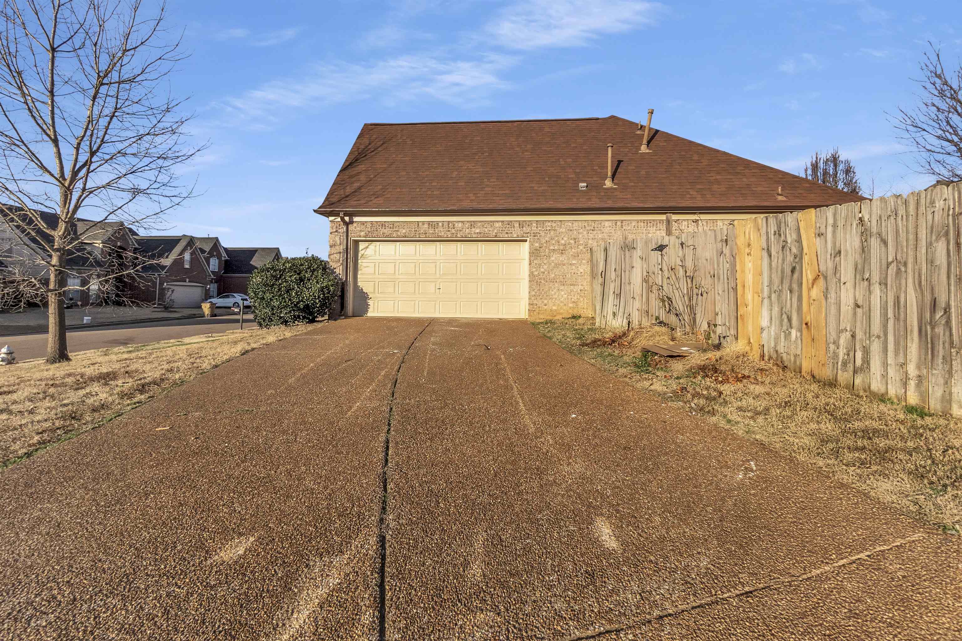 3904 August Moon Cove Memphis, TN 38135 - Photo 25 of 25 a front view of a house with a yard