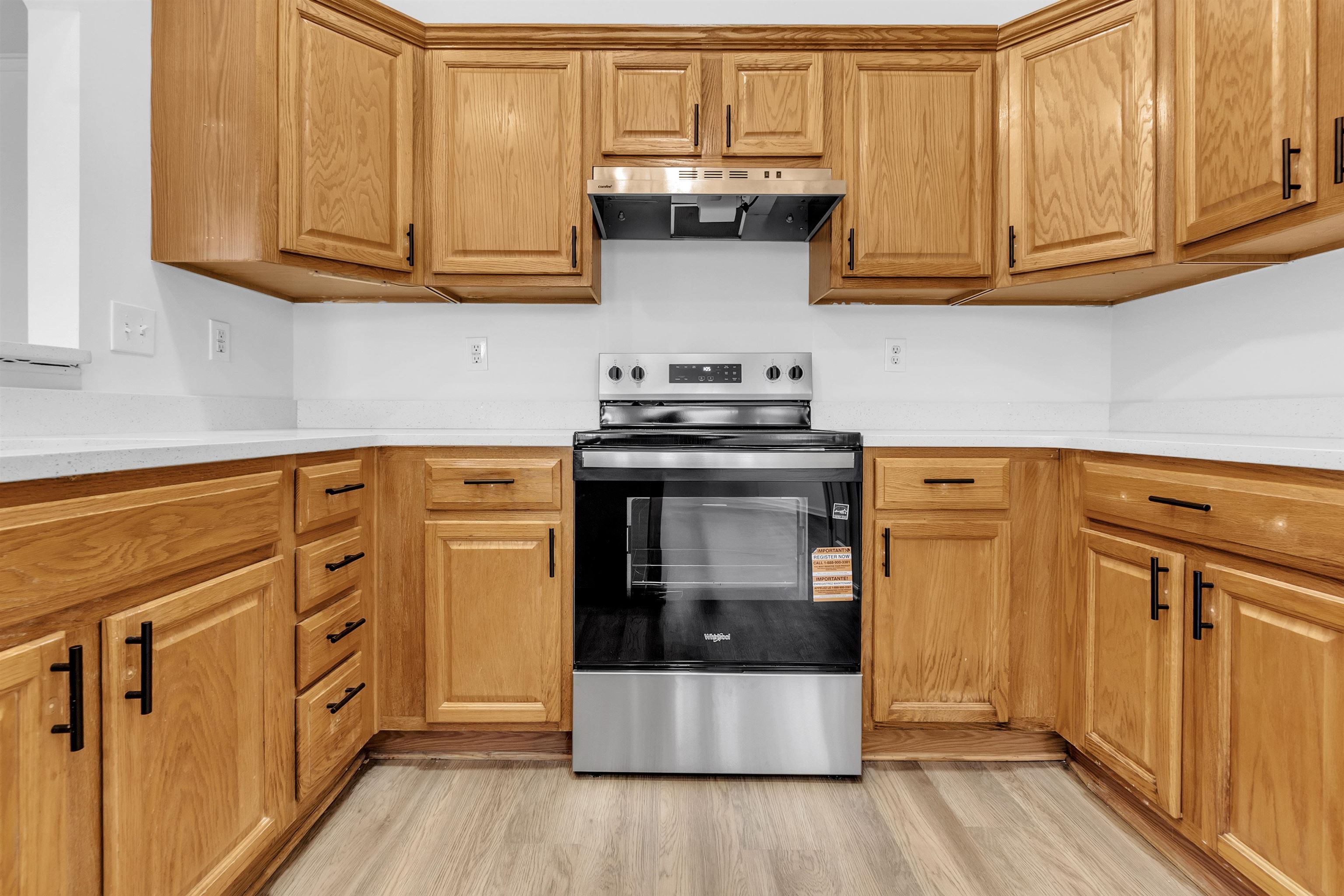 3904 August Moon Cove Memphis, TN 38135 - Photo 3 of 25 a kitchen with stainless steel appliances granite countertop a stove and a white cabinets